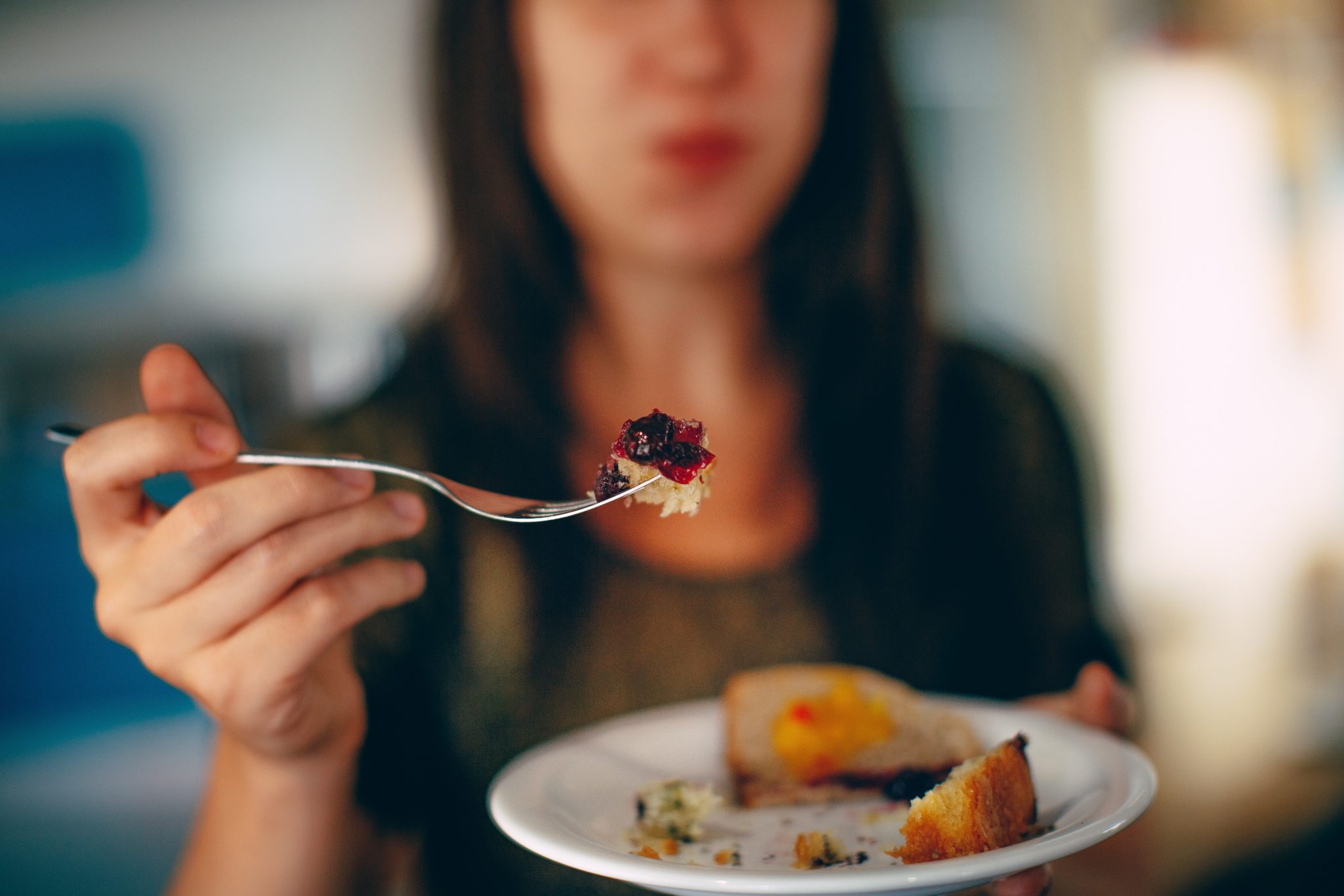 woman emotional eating during coronavirus isolation 