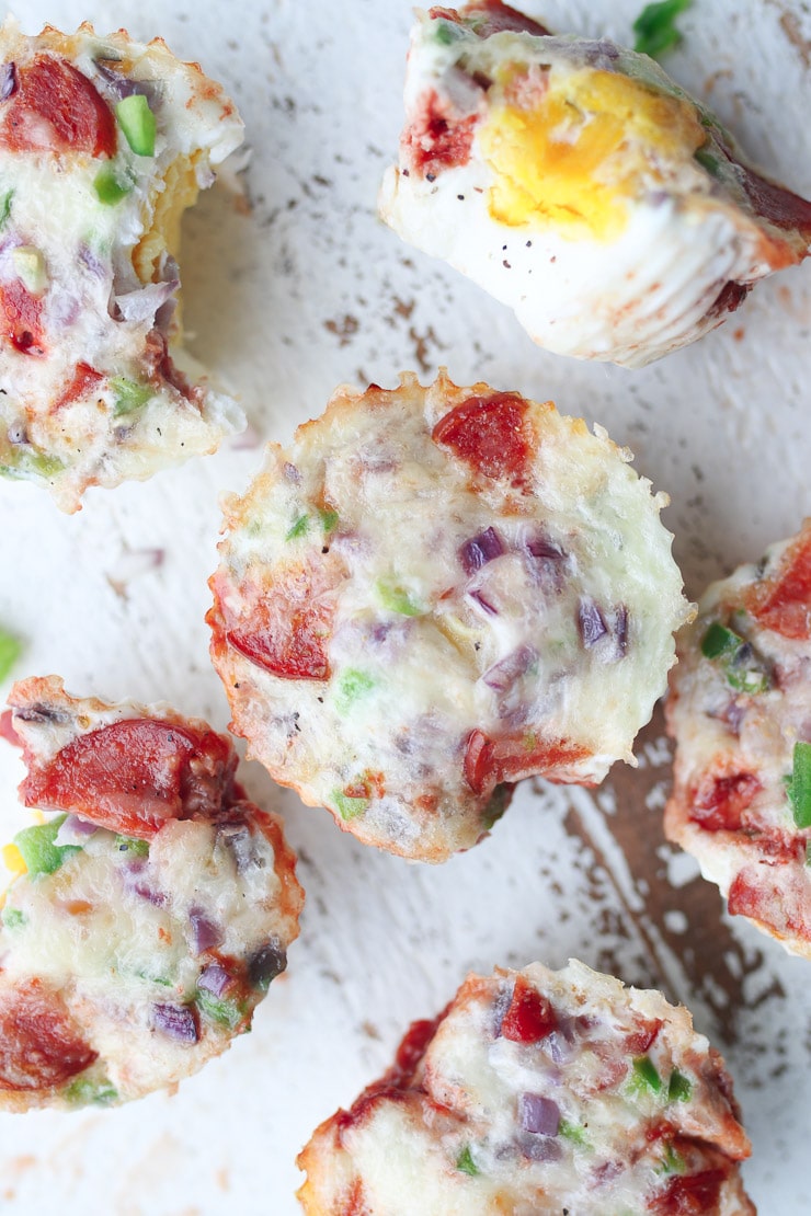 birds eye view of gluten free and keto pizza flavoured egg muffins on a white plate