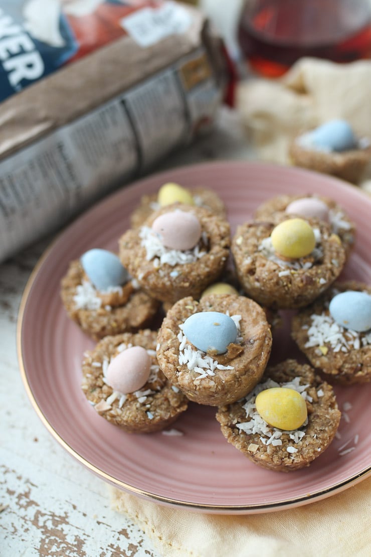 mini easter granola cups stacked on a pink plate 