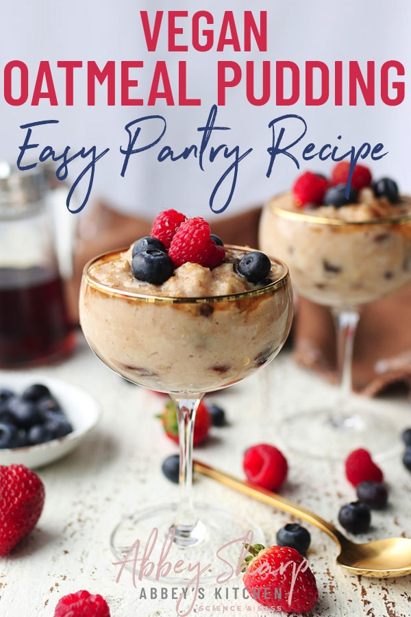 two dessert cups filled with vegan pantry staple oatmeal pudding with fresh berries and maple syrup in the background and text overlay
