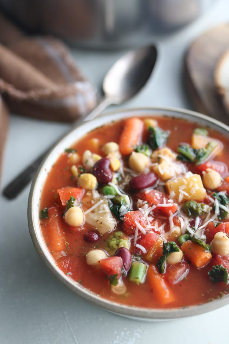 bean & frozen veggie soup in a bowl topped with cheese 
