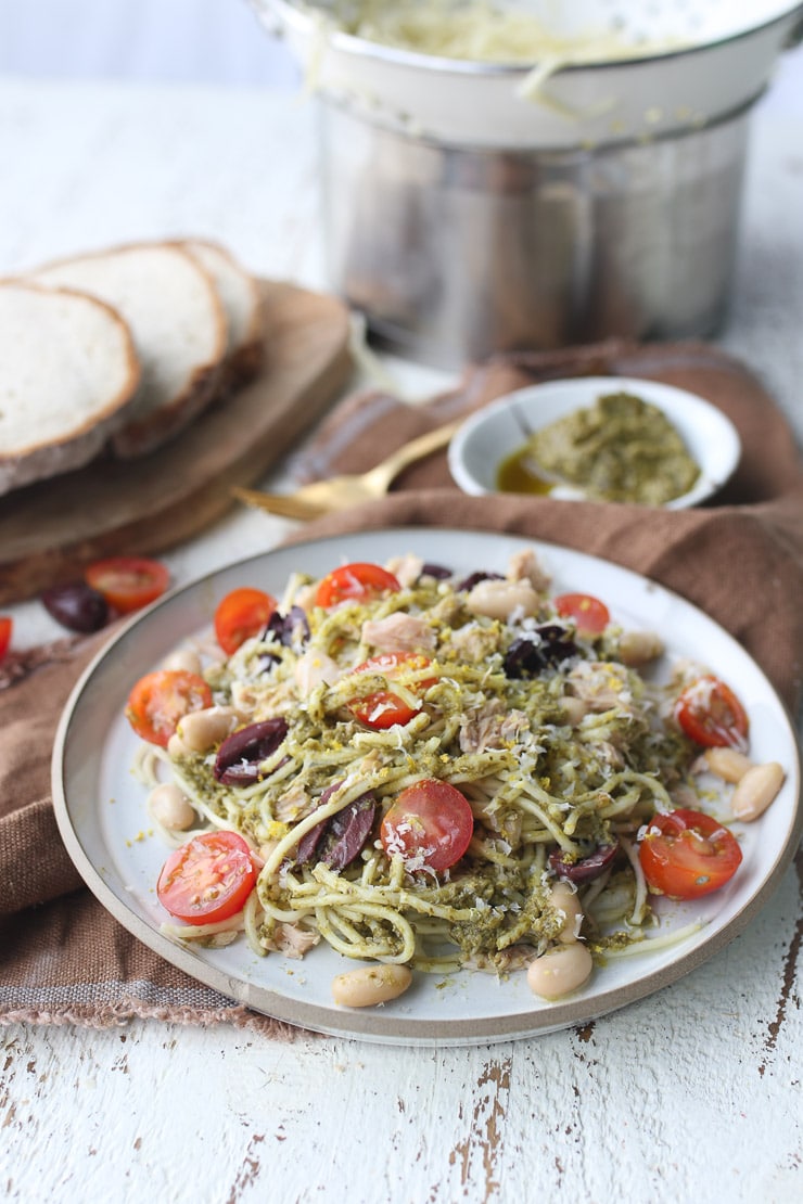 pesto pasta with tuna on a white plate 