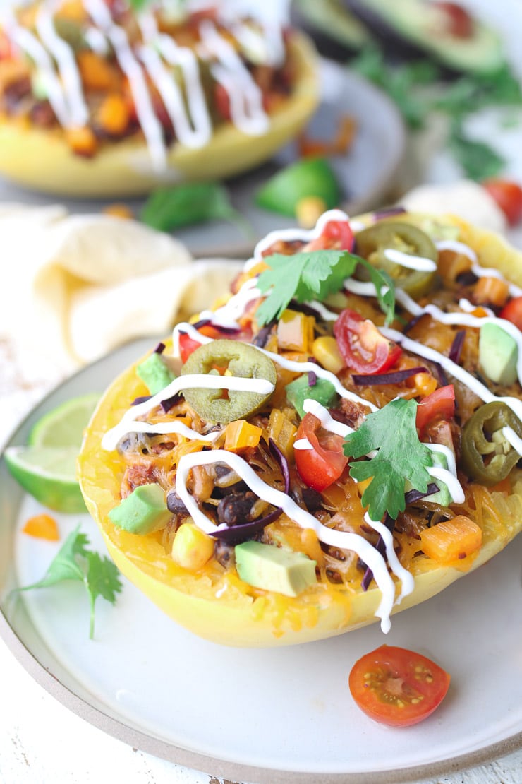 close up of vegan burrito bowl with spaghetti squash topped with cilantro 