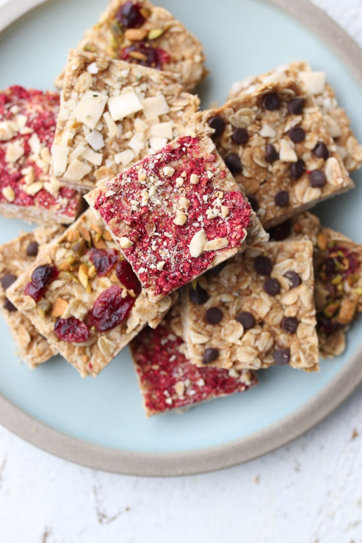 Several no bake oatmeal bars stacked on a blue plate.