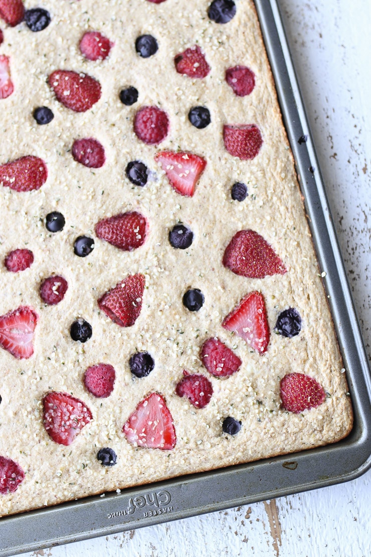 birds eye view close up of sheet pan pancakes with berries.