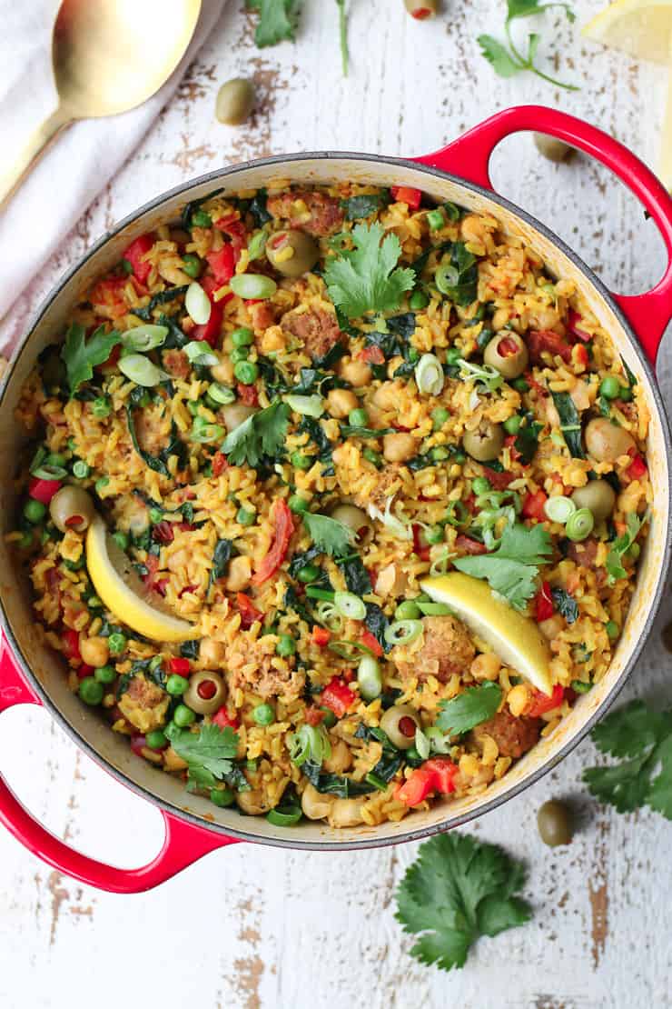 birds eye view of paella in a red pot.