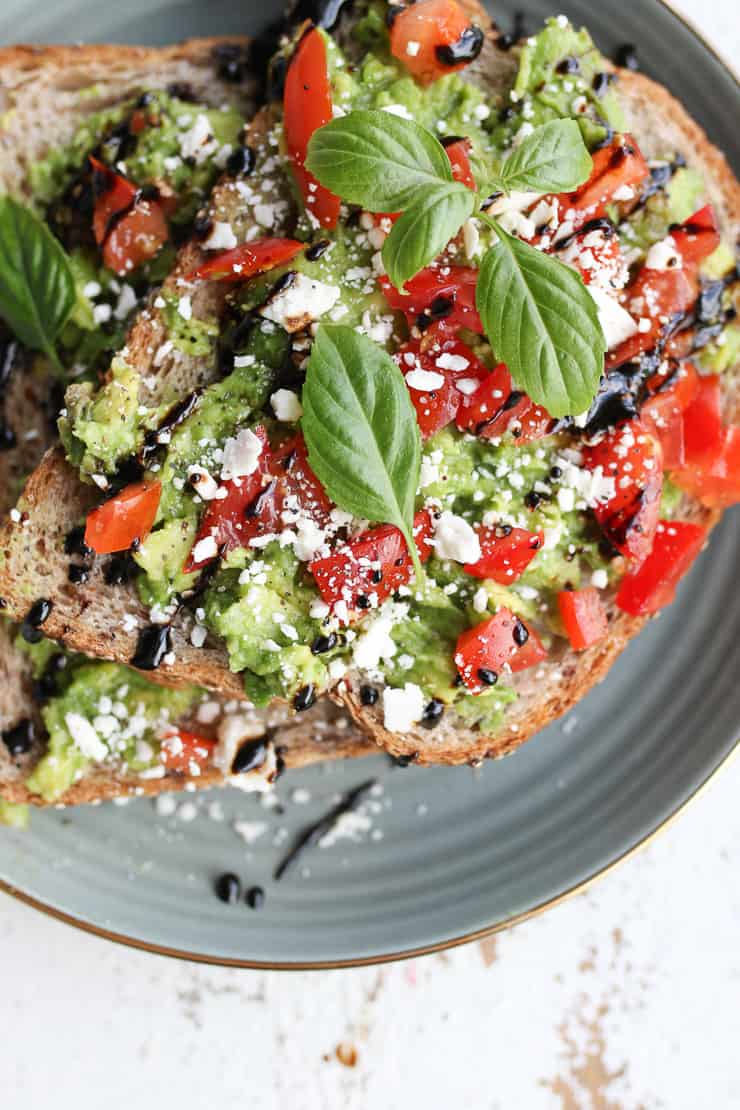 avocado toast on a grey plate 