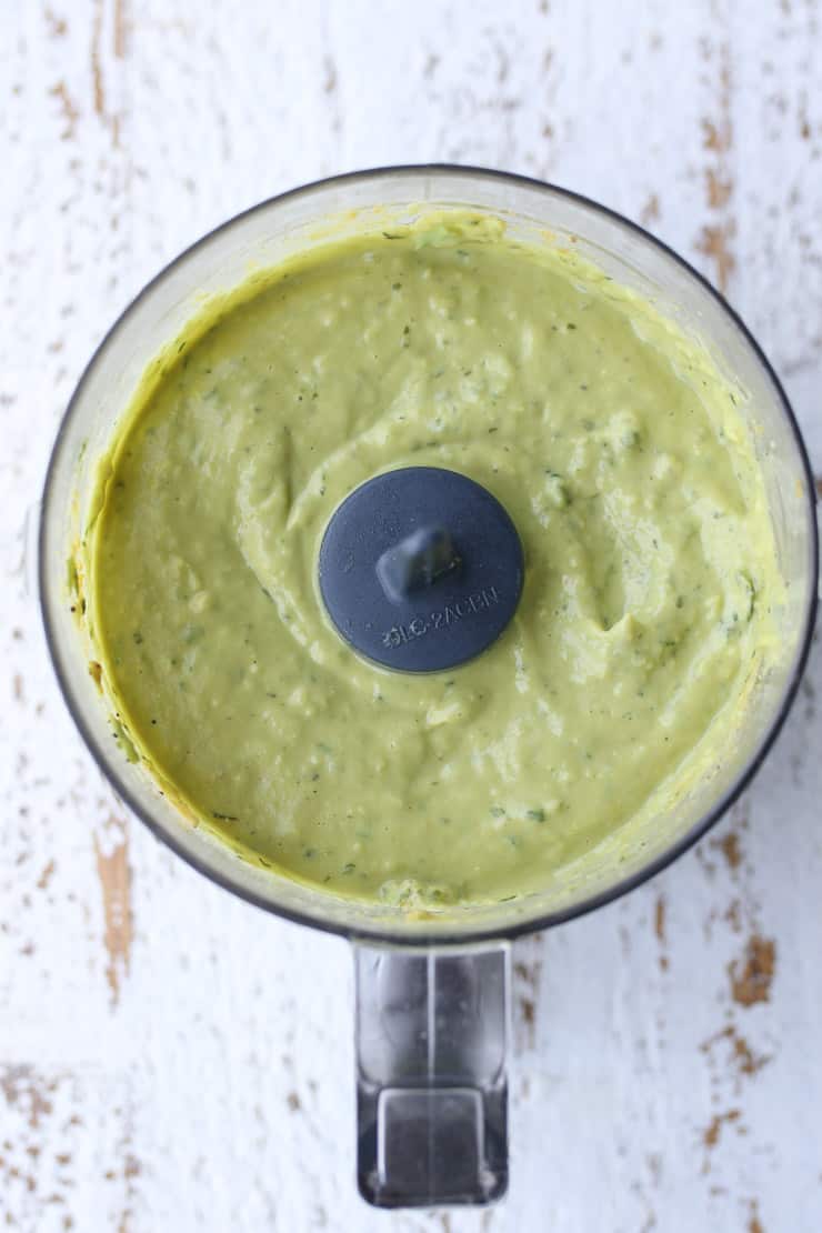 Making avocado salad dressing recipe using a food processor.