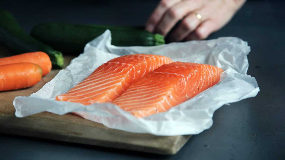 two salmon fillets as a source of protein to help regulate blood sugar levels 