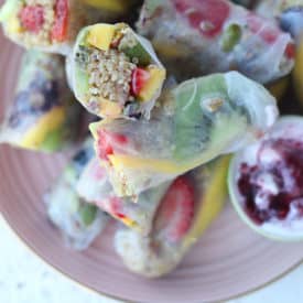 fruit spring rolls on a pink plate