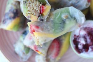 fruit spring rolls on a pink plate