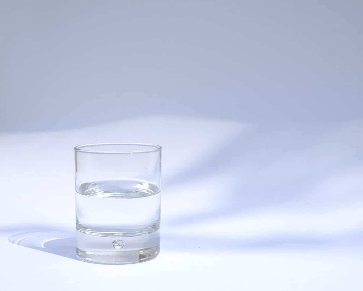 water in a glass for hydration to manage blood sugar levels 