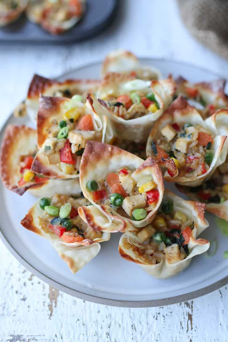 close up of fried rice cups on a white plate.