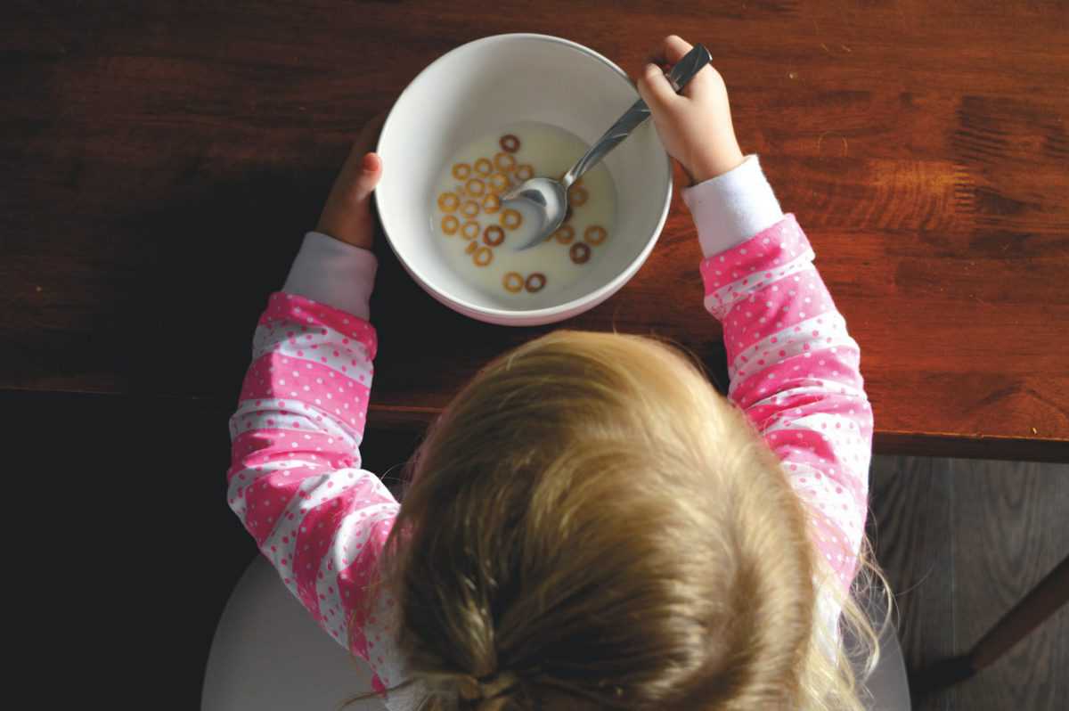 birds eye view of child eating cereal 