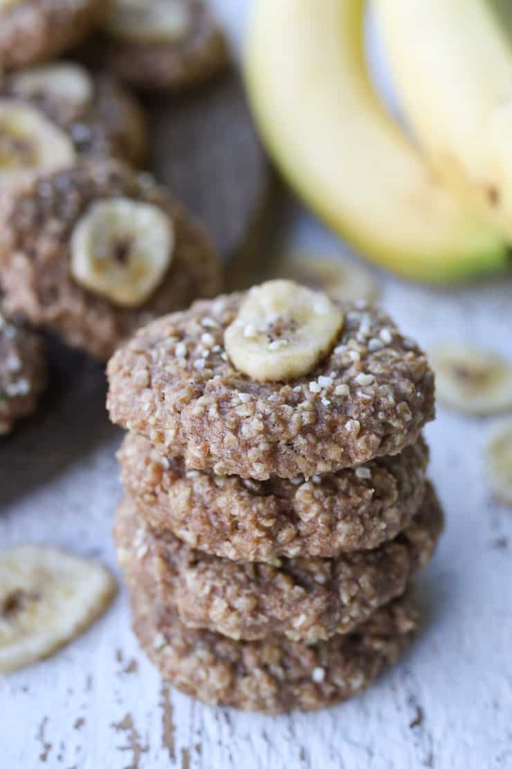 Several vegan oatmeal cookies stacked on top of one another. 