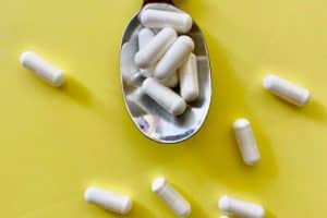 several probiotic capsules on a spoon