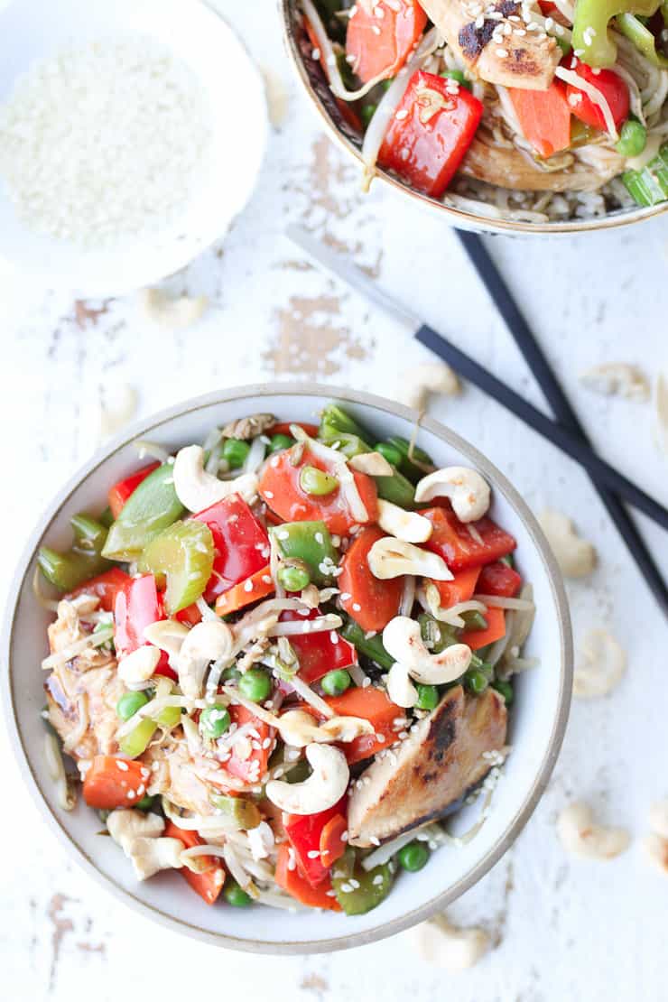 birds eye view of chicken chop suey on a bowl with chop sticks on the side 