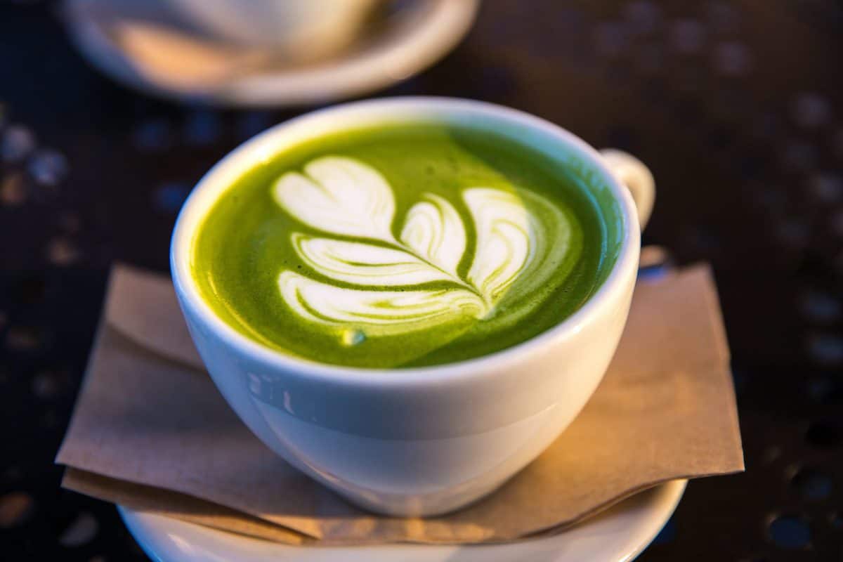 Matcha latte in a white mug. 