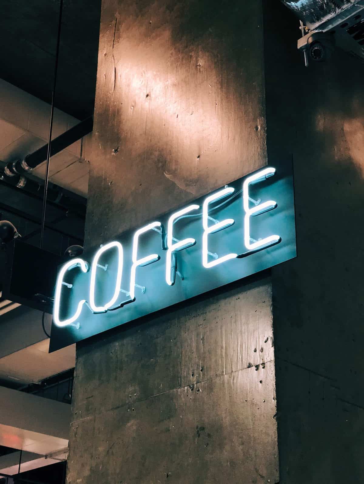 Neon sign that says "coffee". 