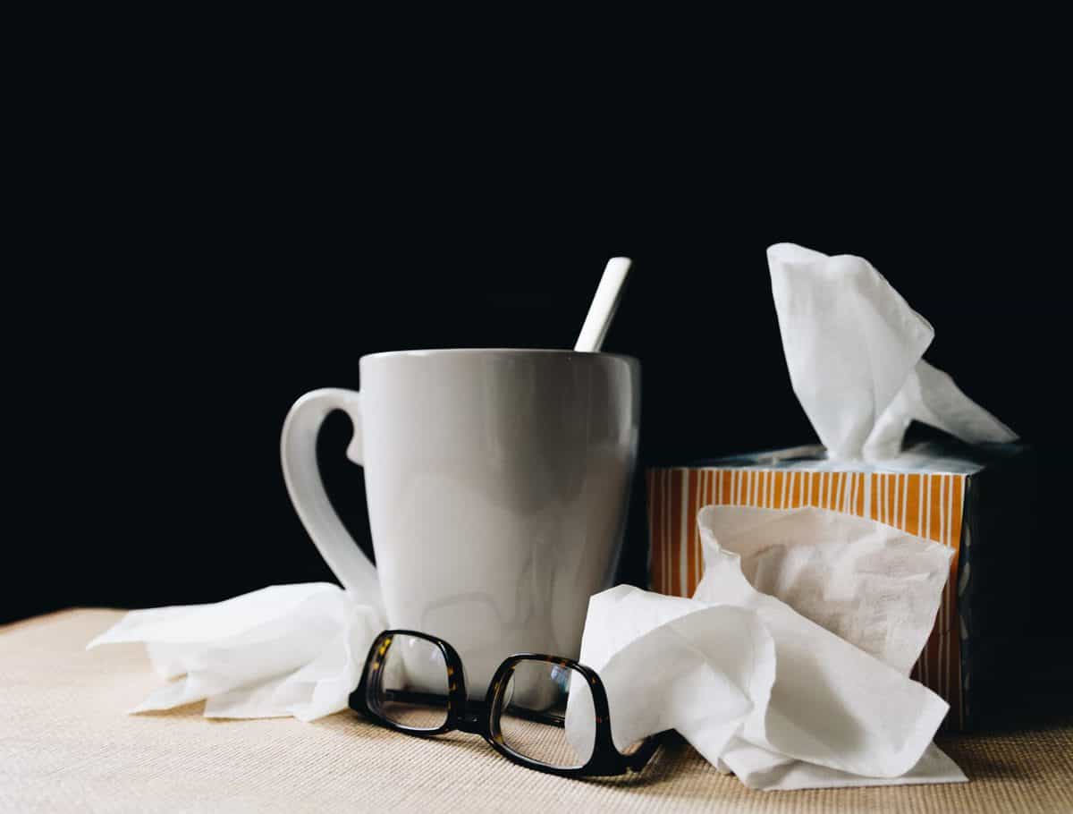 kleenex box and tea from someone who has the keto flu from having keto cheat days