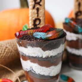halloween dirt cup with pumpkin in the background