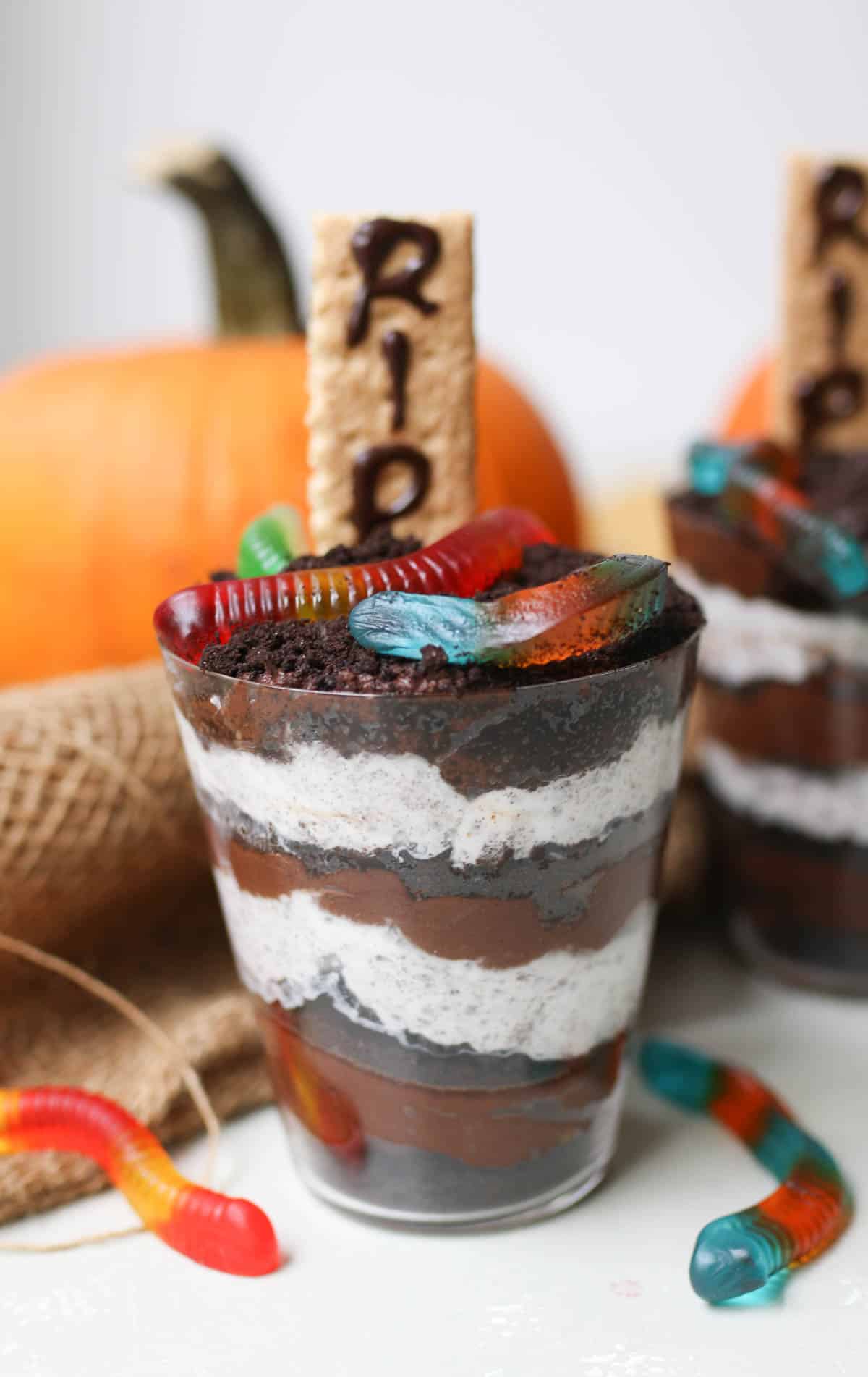 image of halloween dirt cups with gummy worms on top. 