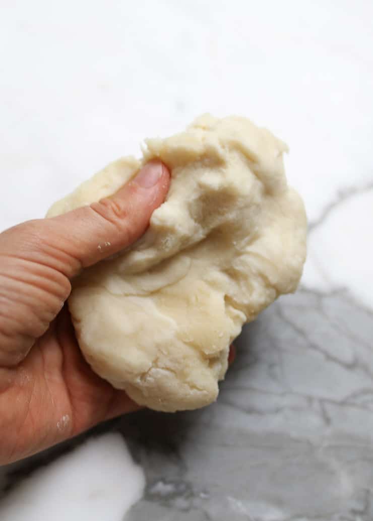 a piece of dough in abbeys hand 