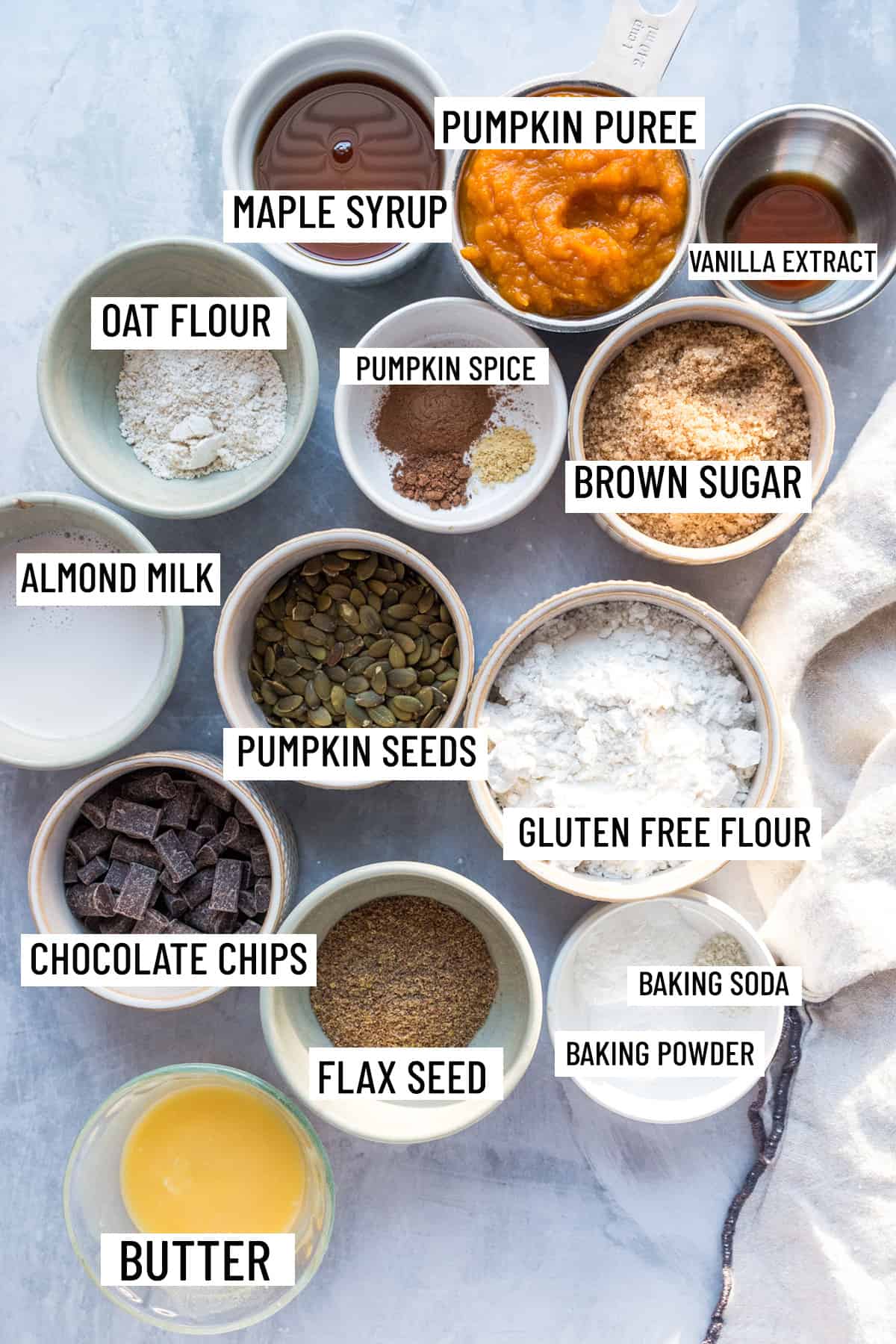 Birds eye view of all ingredients needed to make vegan pumpkin bread portioned into individual bowls and ramekins. 