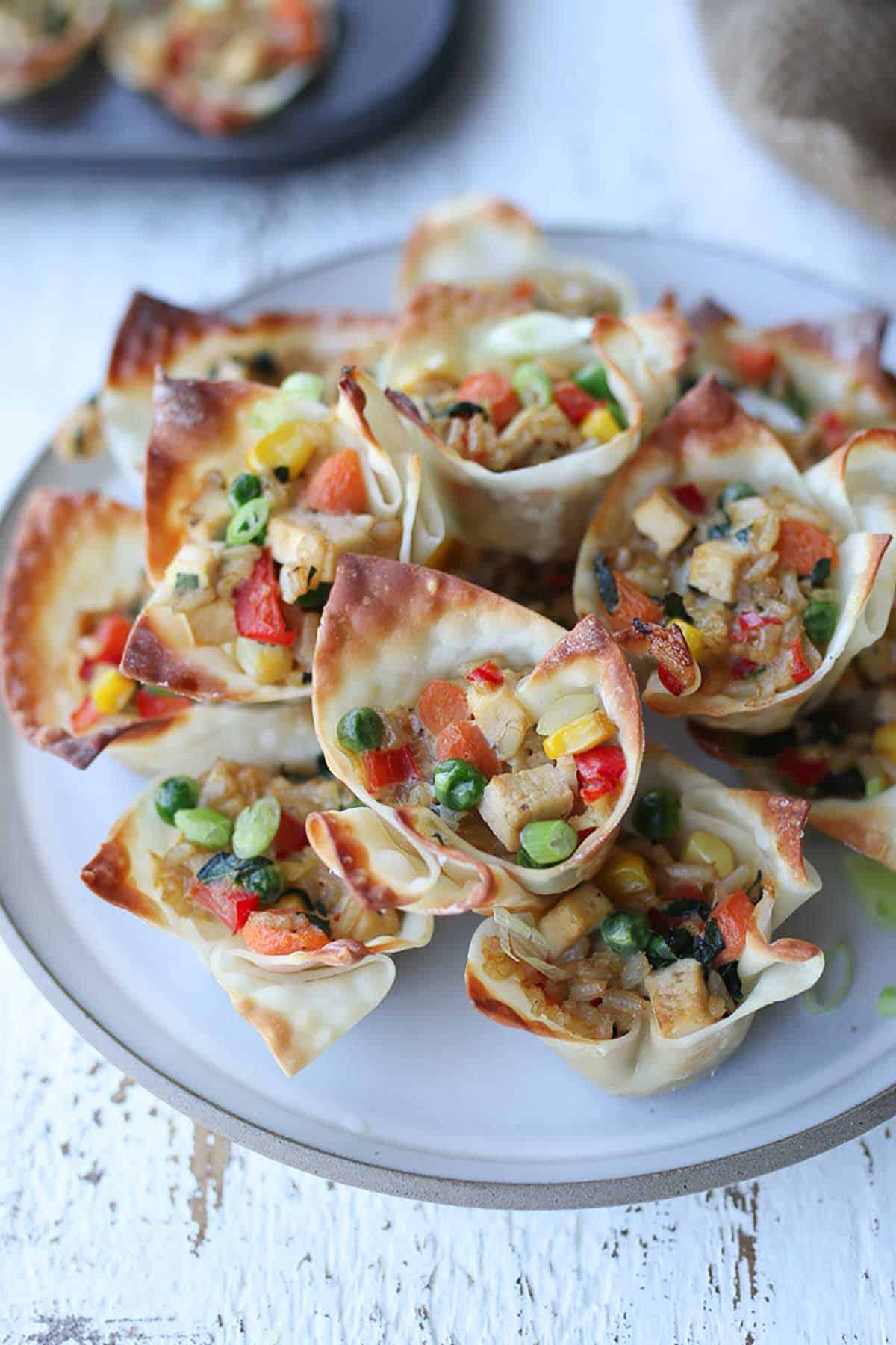 Fried rice cups on a white plate. 