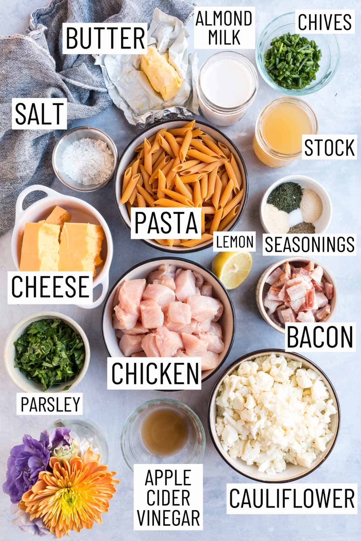 Overhead photo of the ingredients required to make a chicken bacon ranch pasta casserole.