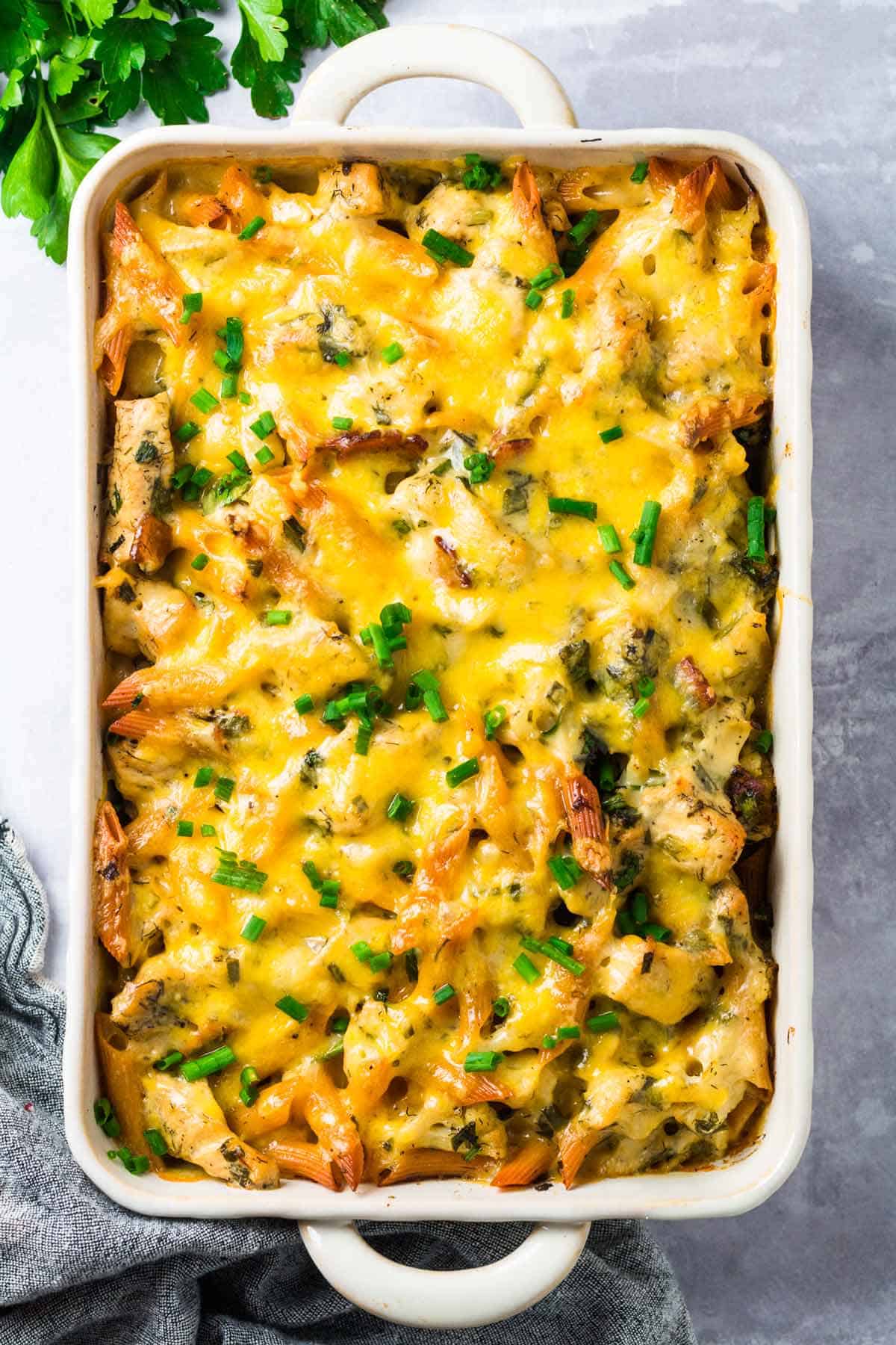 A white baking dish containing chicken bacon ranch pasta.