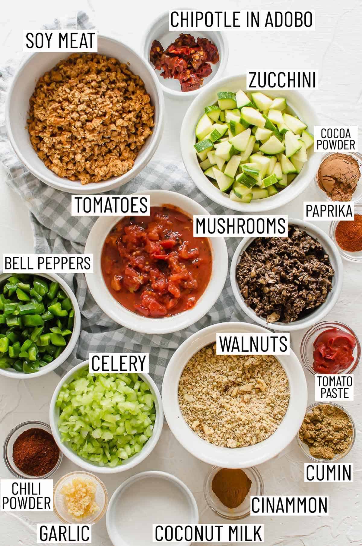 Overhead image of the ingredients required to make a no bean chili laid out in bowls.