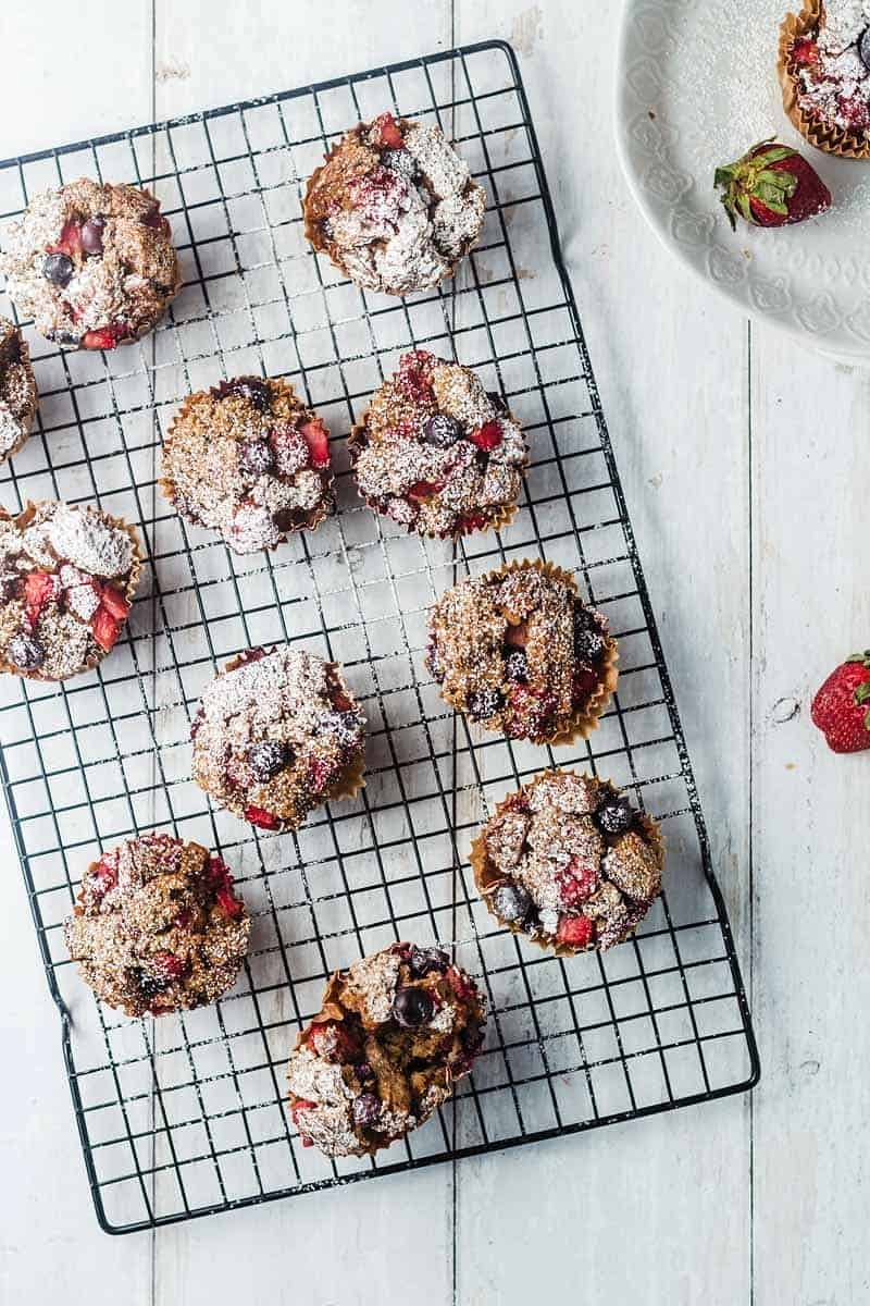 Overhead photo of multiple berry bread pudding cooling on a wire rack.