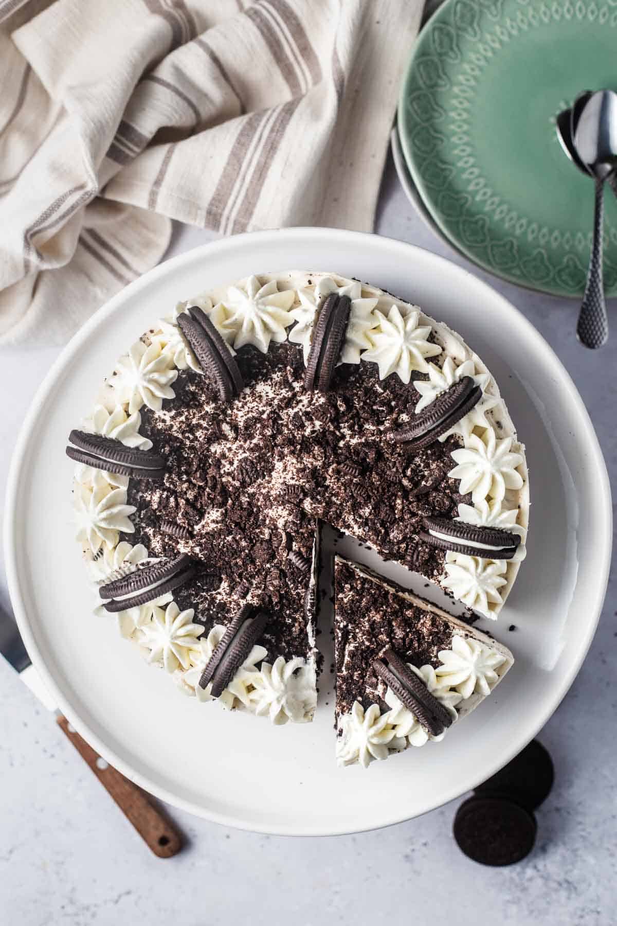 Birds eye view of vegan Oreo cheesecake on a white plate. 