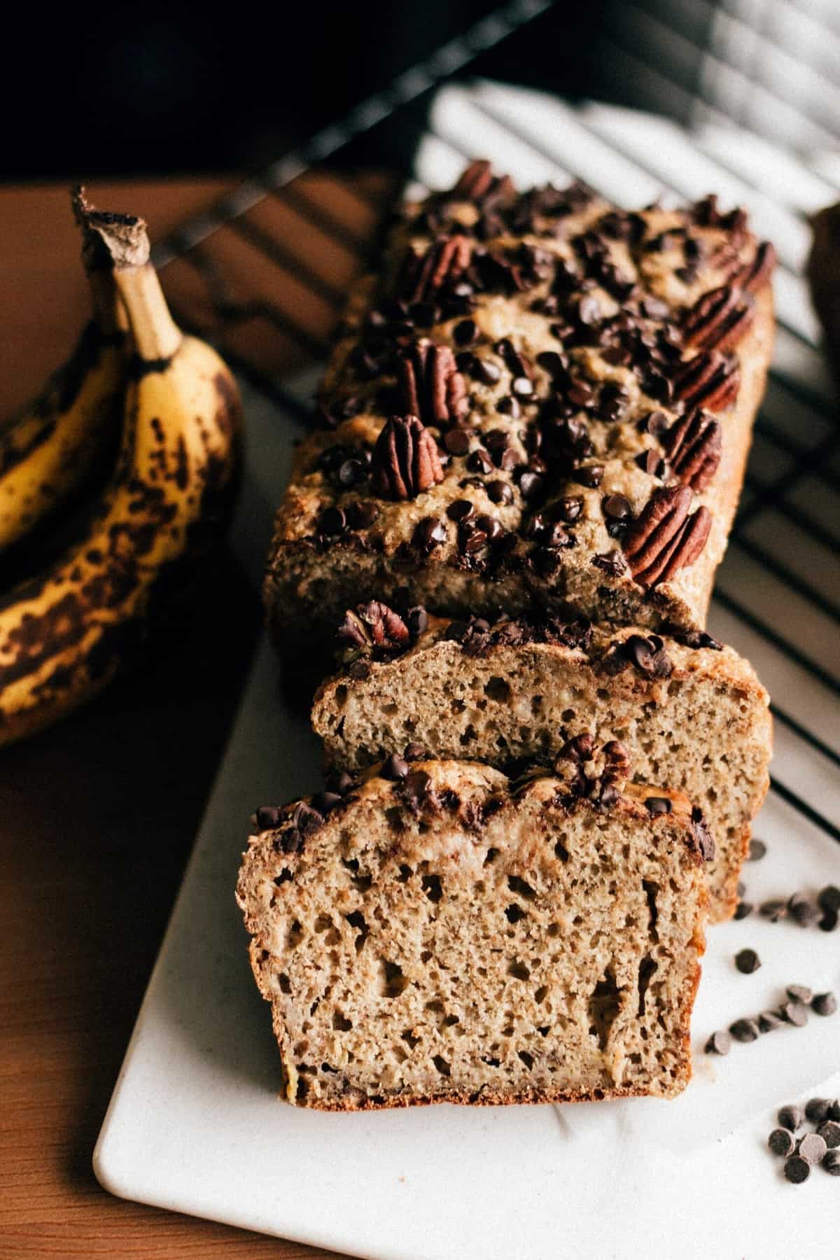 Freshly baked banana bread cut into slices.