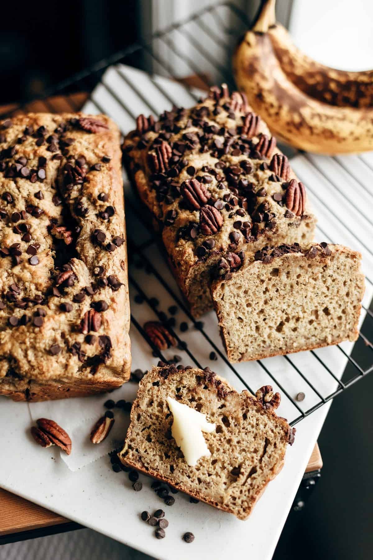 Two loafs of banana bread on a cooling wrack. 