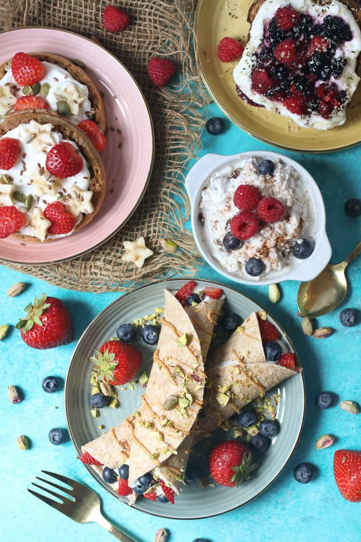 Birds eye view of healthy breakfast options including waffles, oats, and toast.