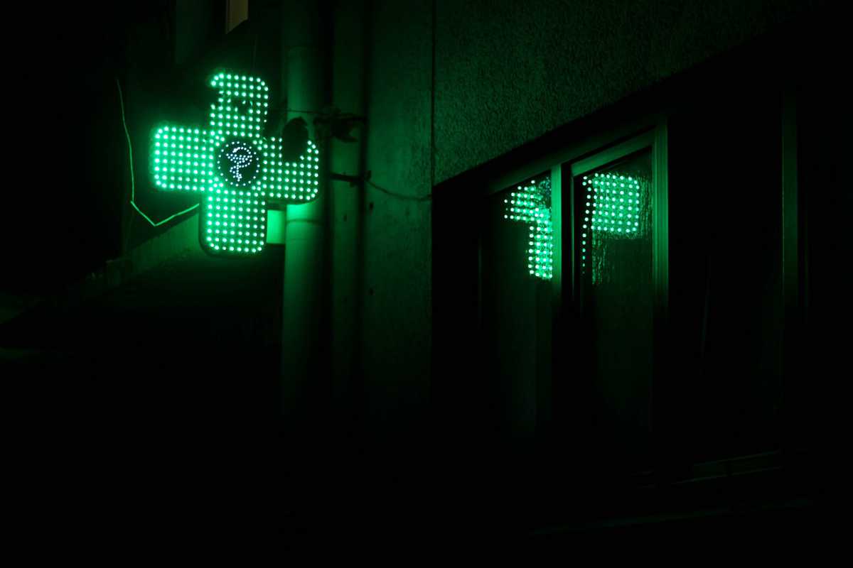 A cross sign to signify a pharmacy where supplements are sold.