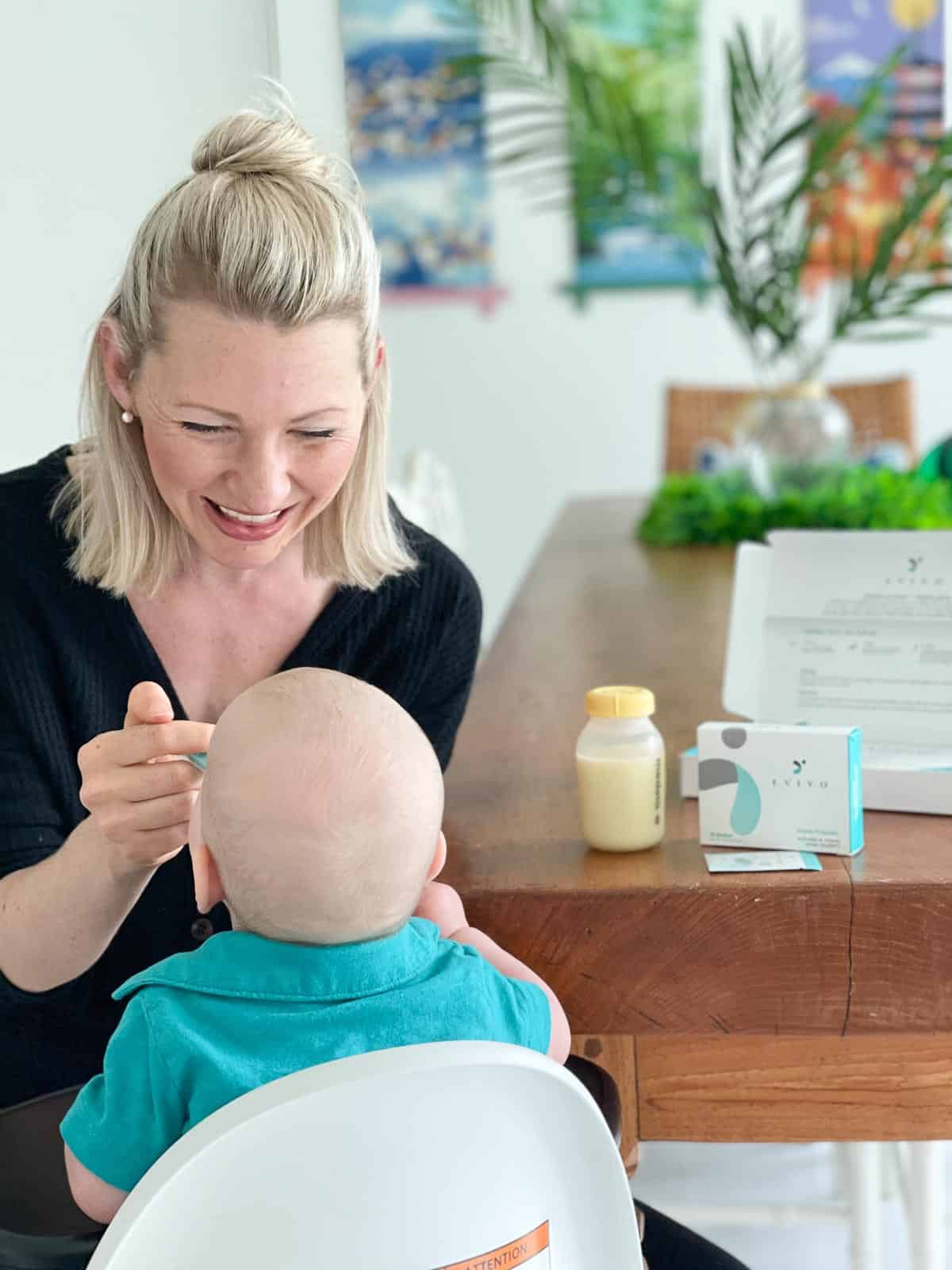 Abbey giving Baby O probiotics to show how to build a baby's immune system.