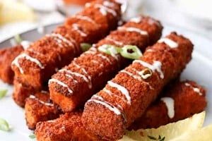 Pinterest graphic of a plate of buffalo tofu sticks.