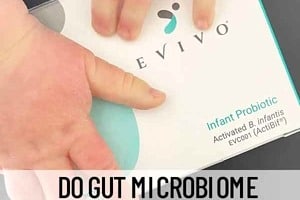 Pinterest graphic of a baby's hand over a box of evivo with the text overlay "do gut microbiome help build a baby's immune system?"