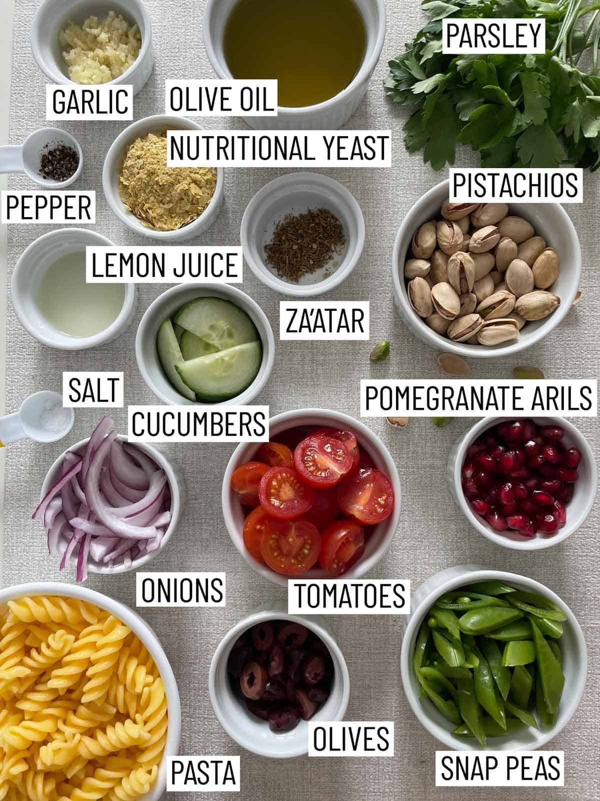 Ingredients needed to make pesto pasta salad.