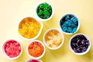 Pinterest graphic of bowls of gummy bears with the text overlay "sugar bear hair does it work?"