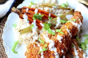 Pinterest graphic of a plate of buffalo chicken strips with homemade ranch dip drizzled on top.