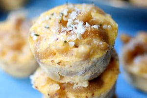 Pinterest graphic of a stack of three mac and cheese bites.