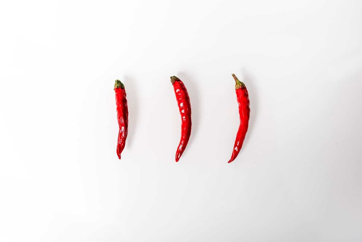 Three chili peppers to represent Arbonne ingredients.