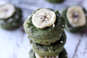 Pinterest graphic of a stack of spinach muffins with banana on top.