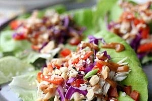 Pinterest graphic of a plate of chicken lettuce wraps with the text overlay "easy no-cook recipe chicken lettuce wraps."