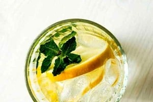 Pinterest graphic of a glass of lemon water with text overlay "why you should avoid goop detox diets."