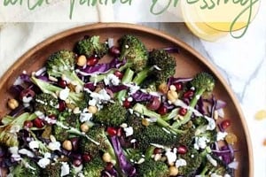 Pinterest graphic of a large plate of salad with a text overlay "roasted broccoli salad with tahini dressing."